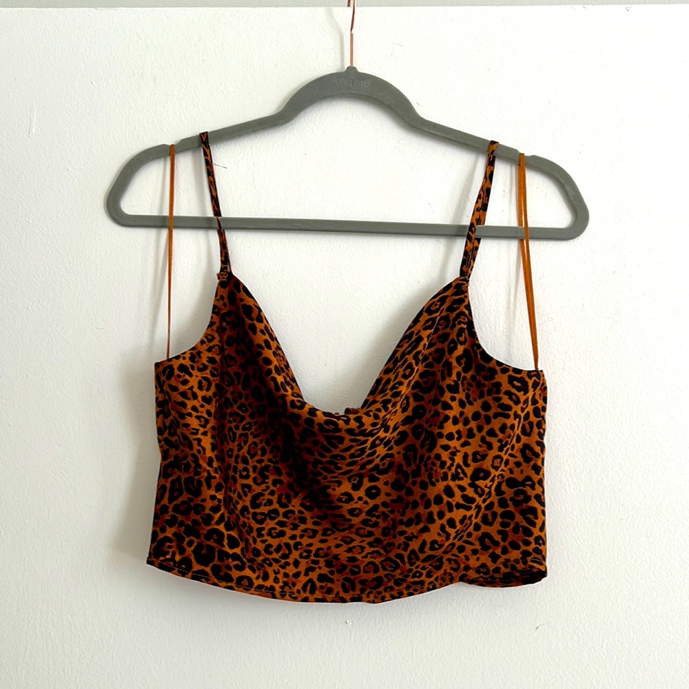 Lightly worn, zip up back, cheetah print top